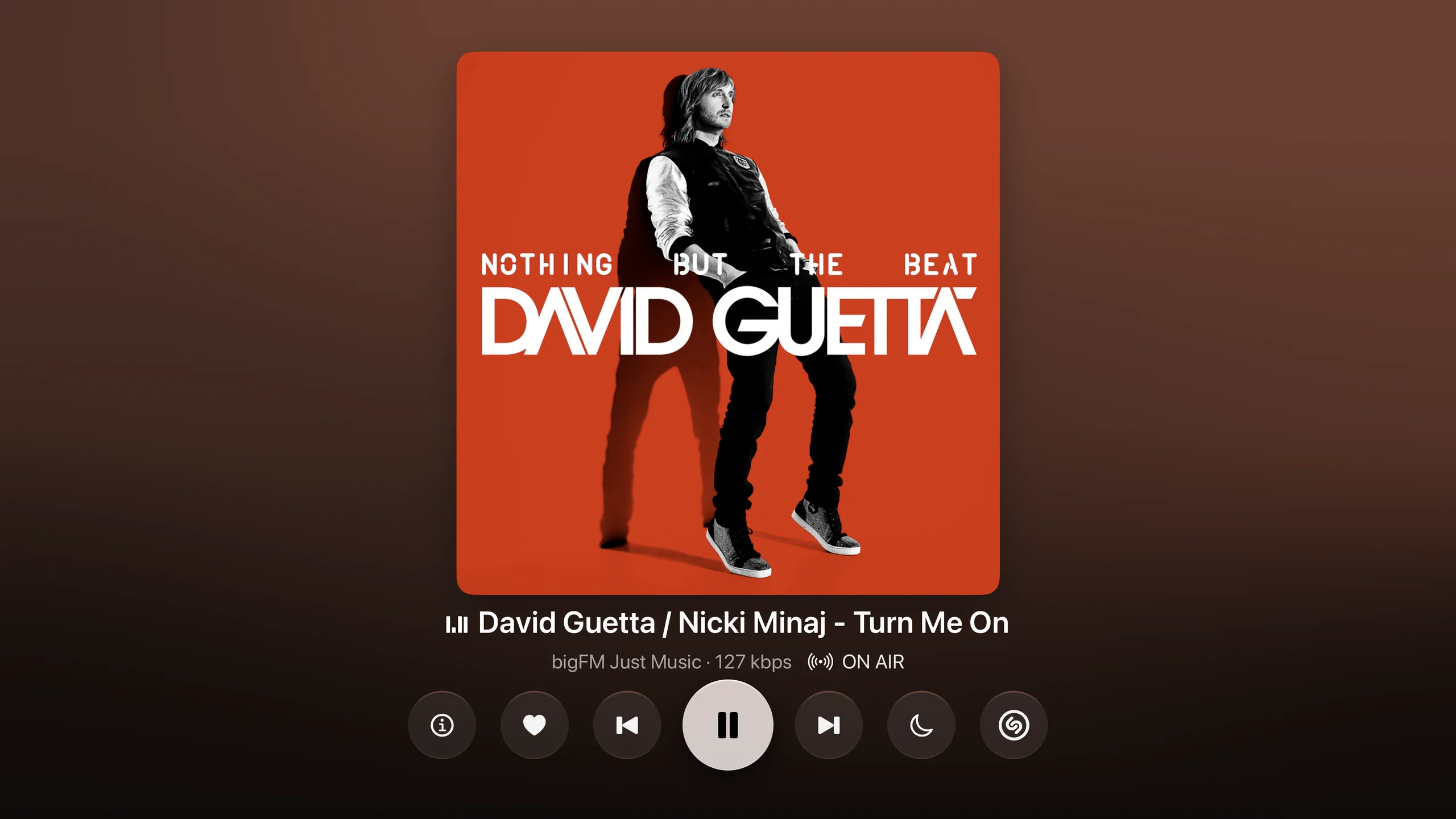 TuneDip Now Playing on Apple TV, presented with an Apple TV box and Siri Remote on a black reflective floor.